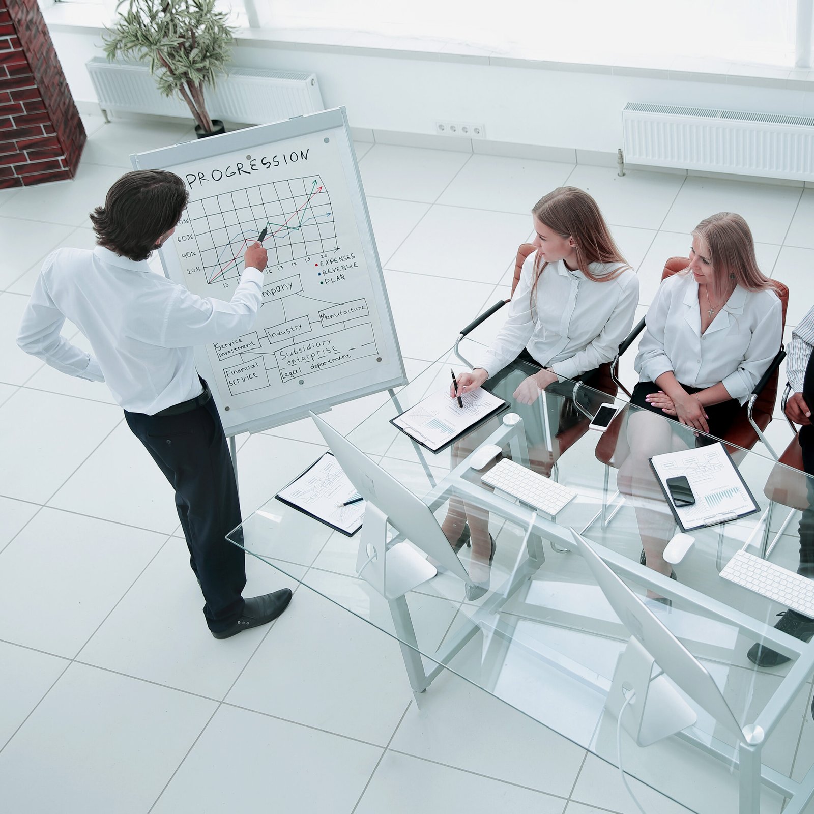 businessman presenting his new marketing plan to his coworkers.